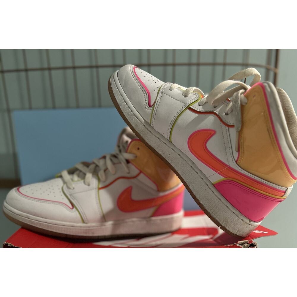 Nike Air Jordan 1 Mid 'Edge Glow' sneakers.